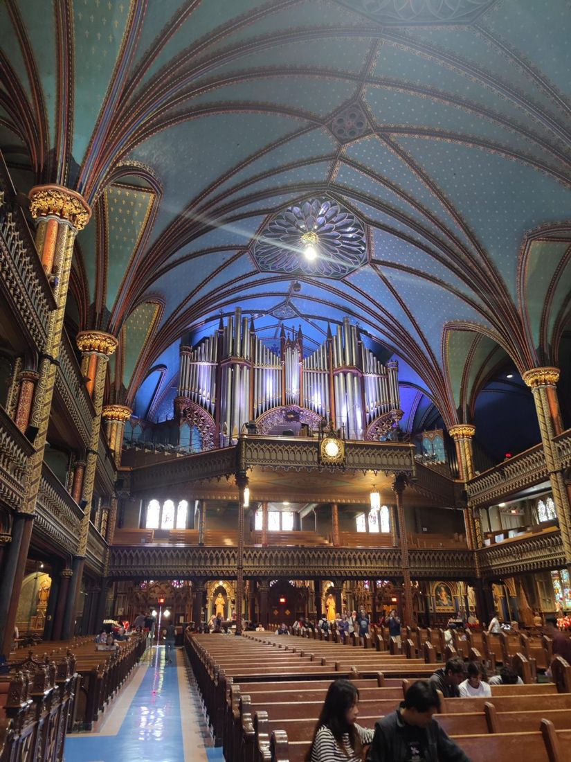 The blue vaulted ceiling and organ of Notre-Dame Basilica
